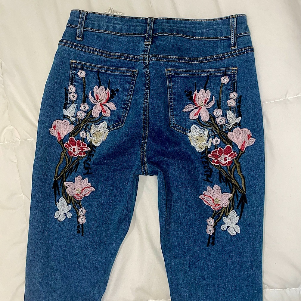 Embroidered bell bottom jeans